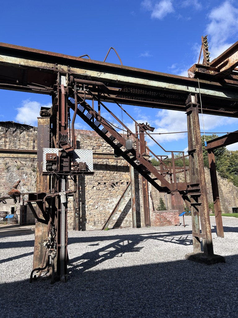 Metal frames, including a staircase. Once part of the steelwork's interior. Now these structures stand out in the open.